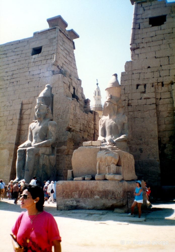 Minaret of Moslem Mosque can be seen at entrance to Luxor Temple