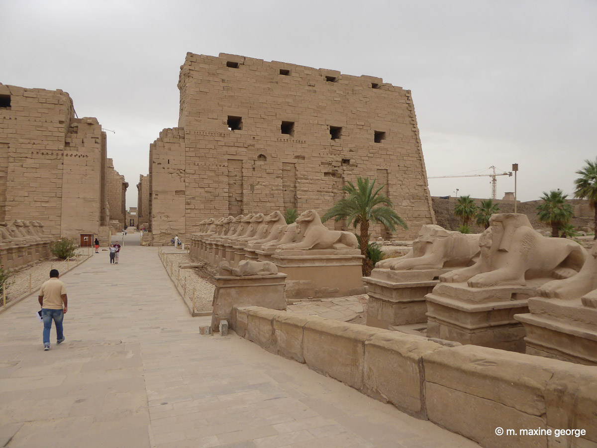 An avenue of ram headed sphinx lead to entrance pylons at Karnak Temple