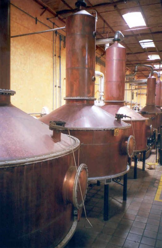 Copper distillers or alambiques distill tequila in Jose Cuervo distillery